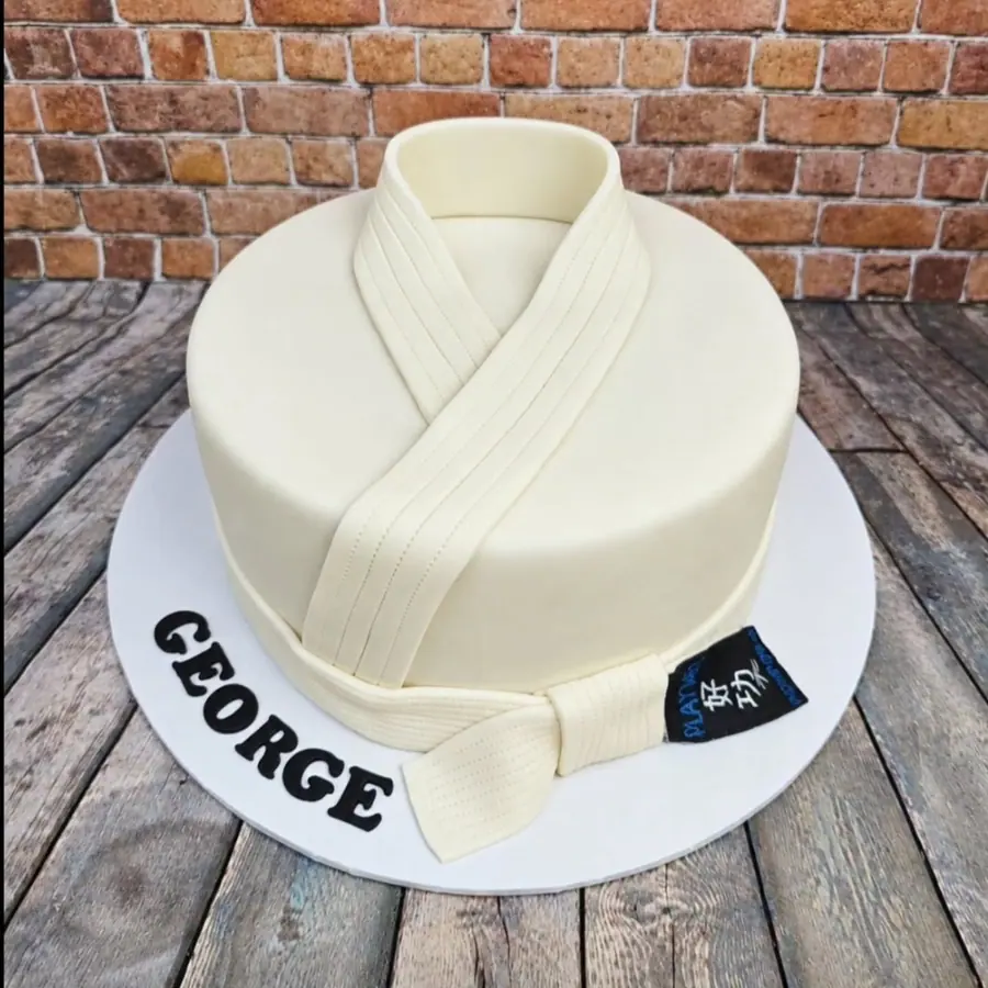 A white karate-themed birthday cake Liz made for her youngest