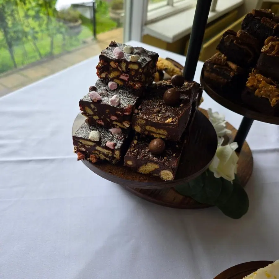 Rocky road and brownies on a tiered stand at a wedding