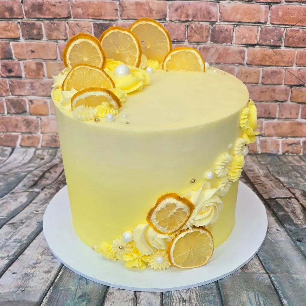 A lemon cake topped with dried lemon slices
